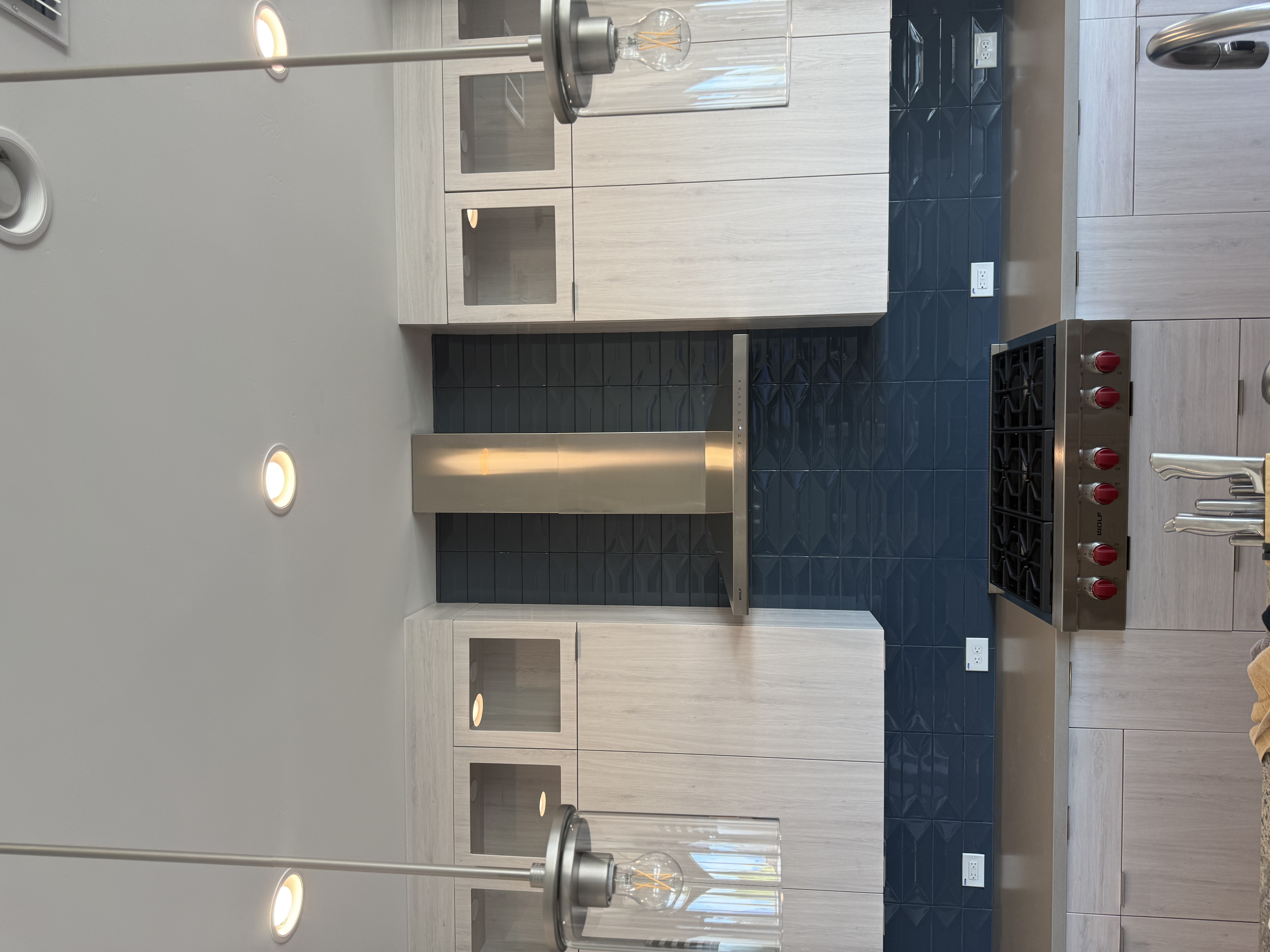 Blue tile kitchen backsplash with range by Level Up Tile