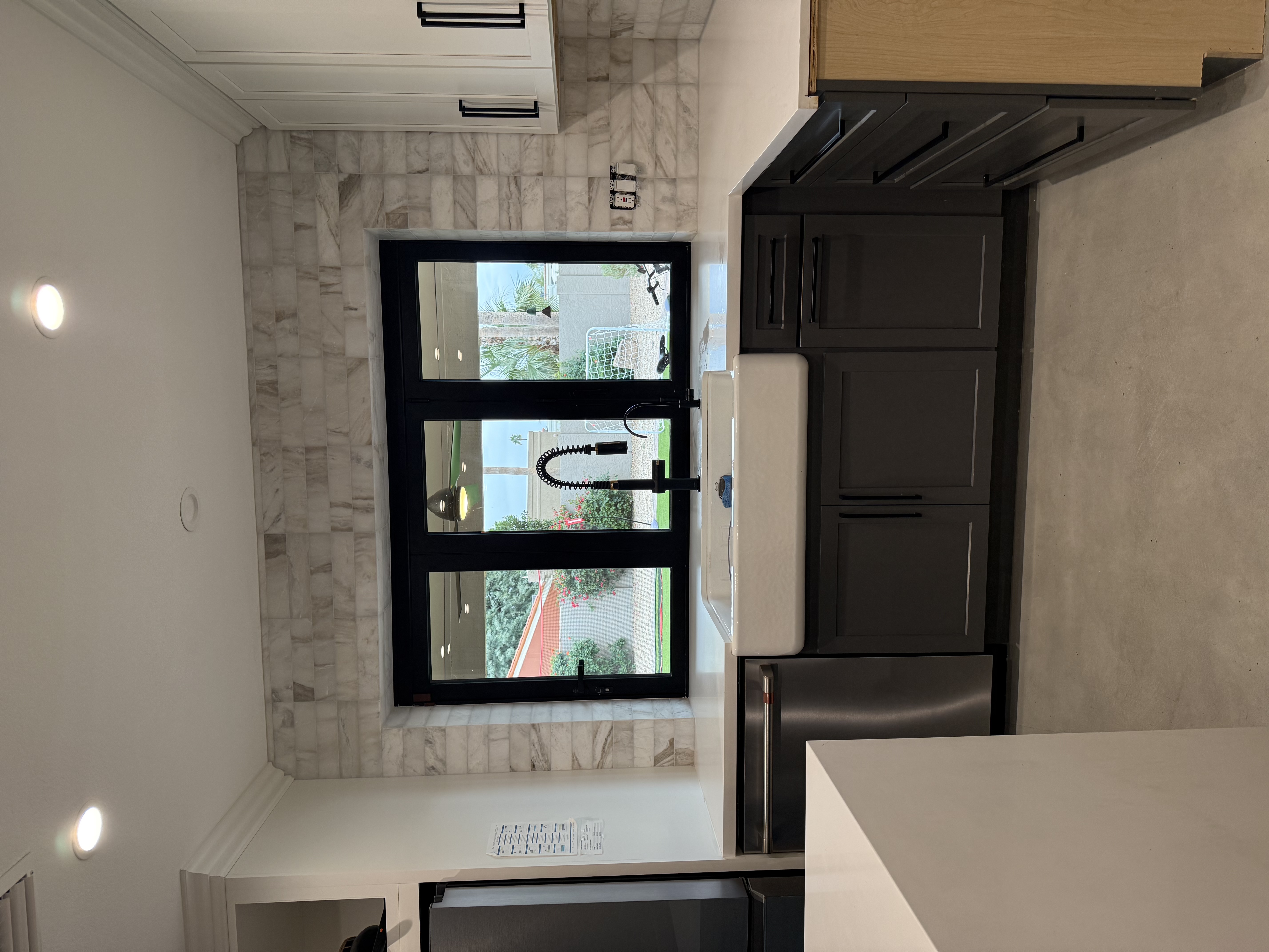 Marble backsplash around kitchen window by Level Up Tile in Scottsdale AZ