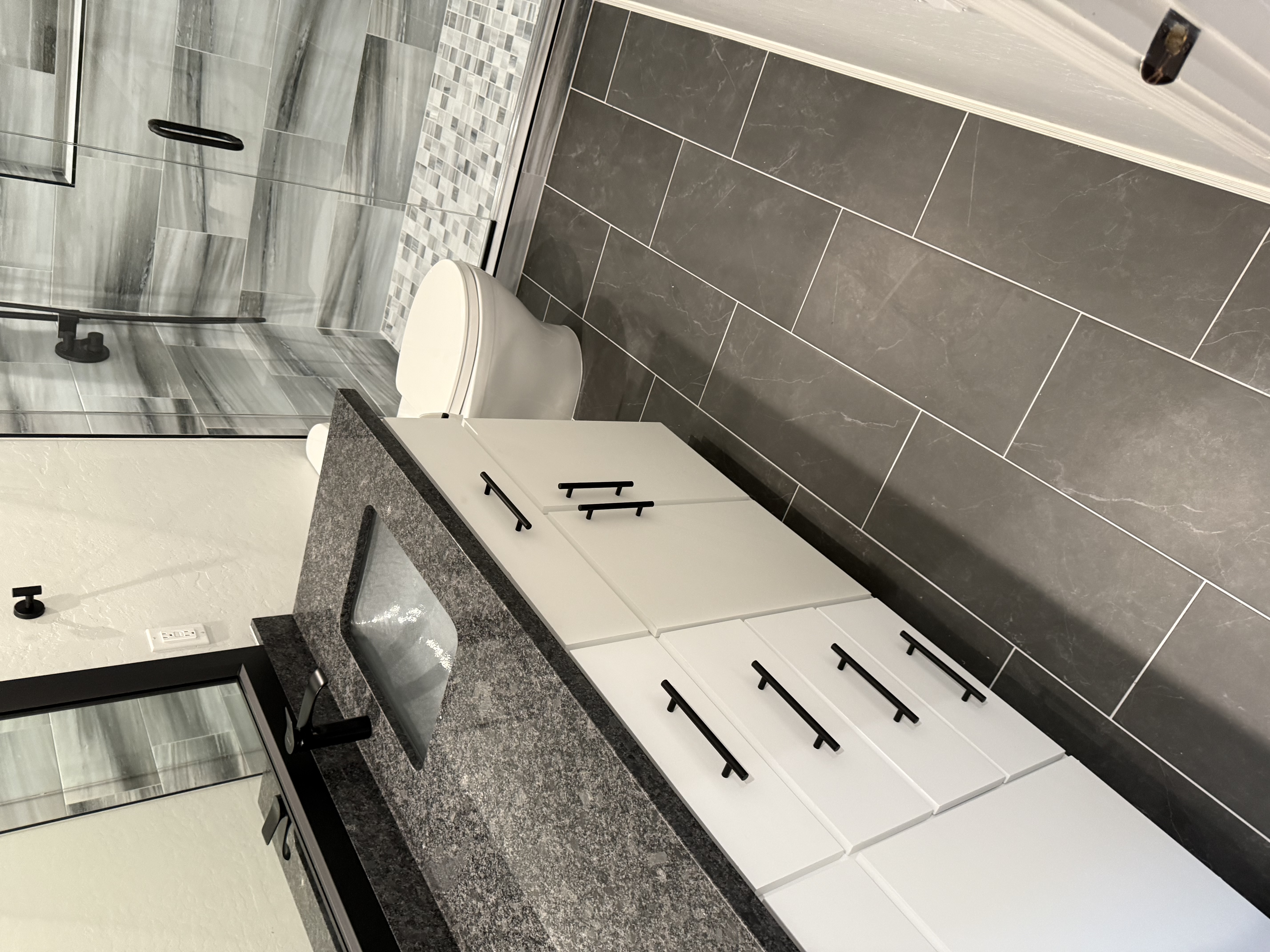 Full dark bathroom remodel by Level Up Tile