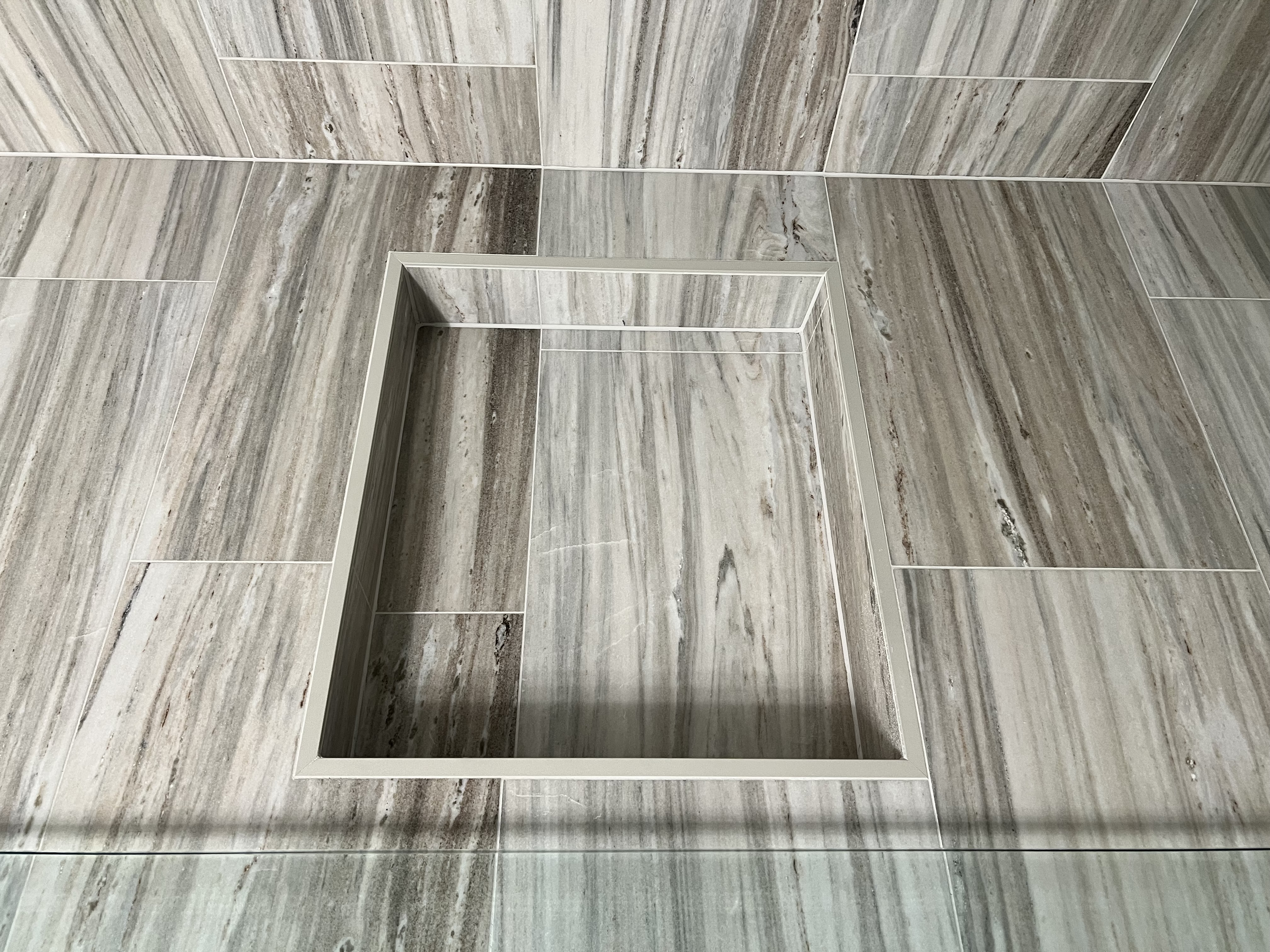 Wood-look tile shower niche by Level Up Tile