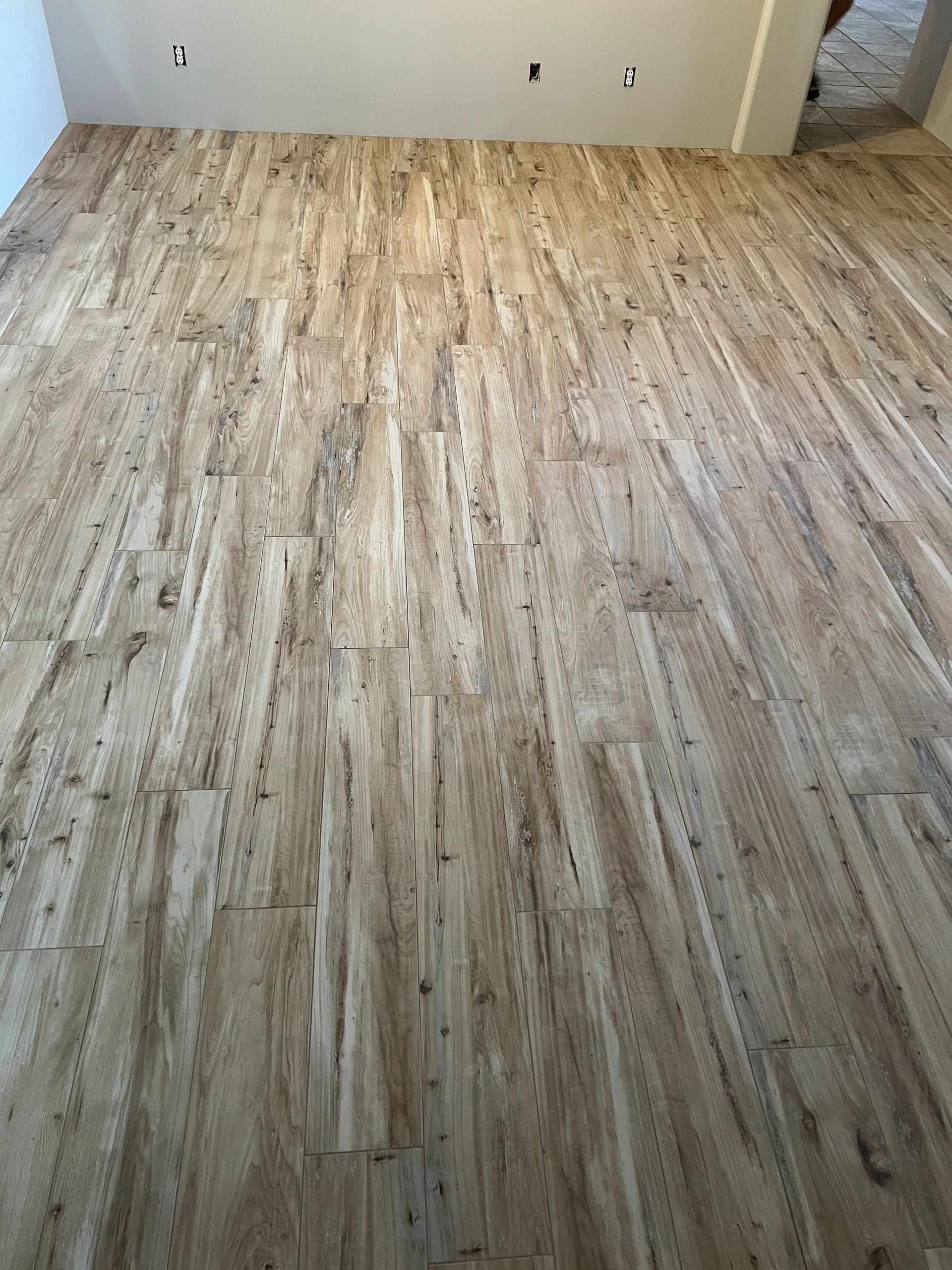 Wood-look porcelain tile flooring installation by Level Up Tile in Peoria AZ