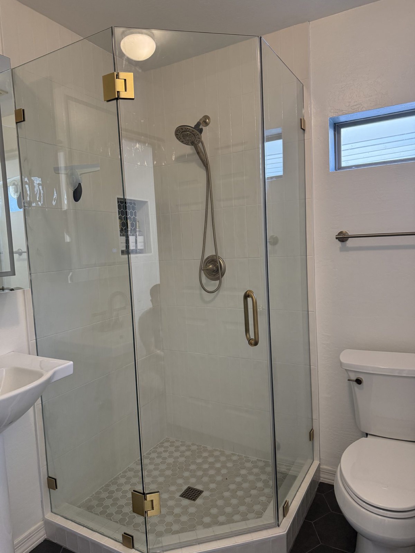 Neo-angle corner glass shower enclosure by Level Up Tile in Peoria AZ