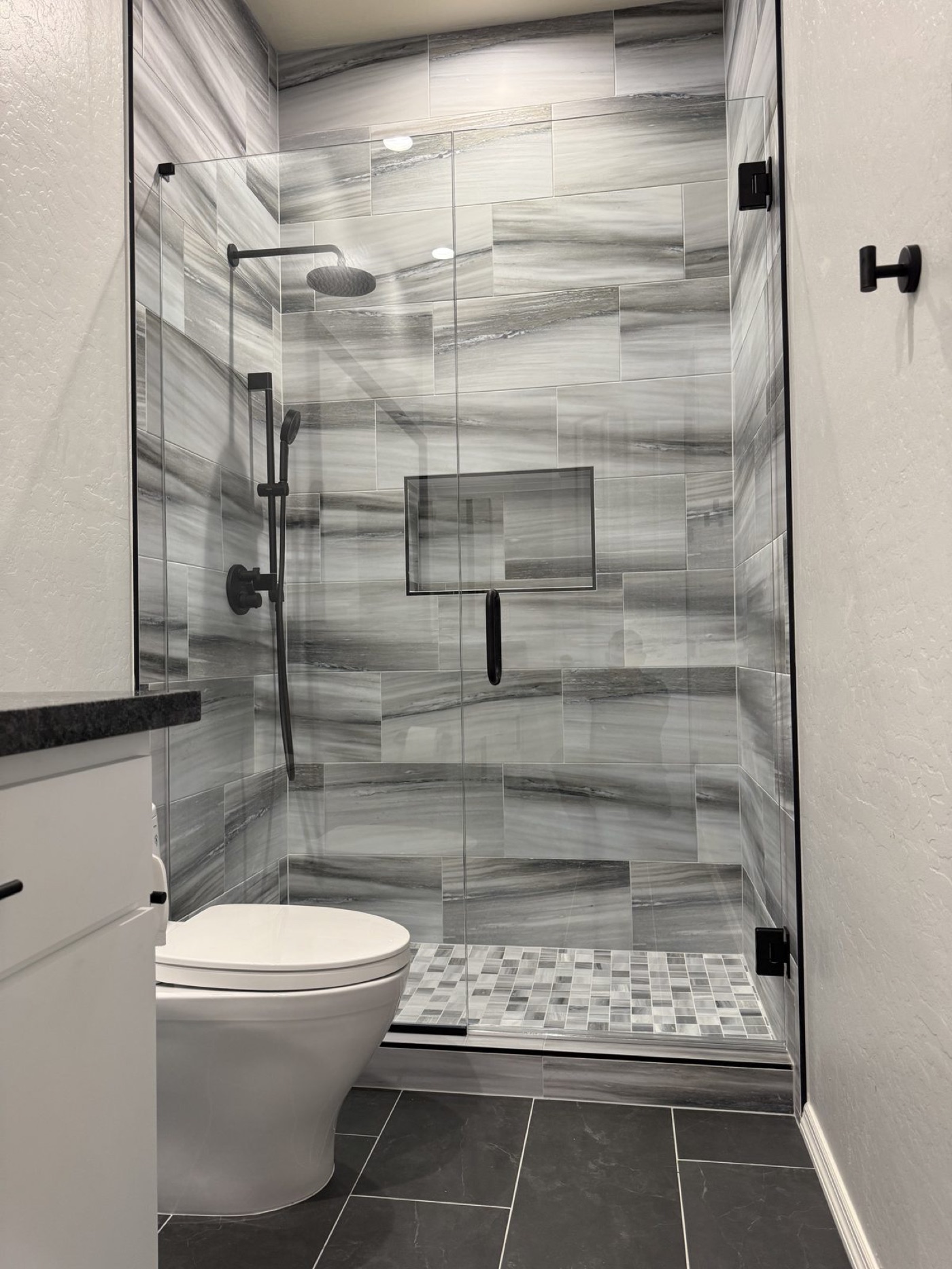 Semi-frameless glass shower enclosure by Level Up Tile in Scottsdale AZ