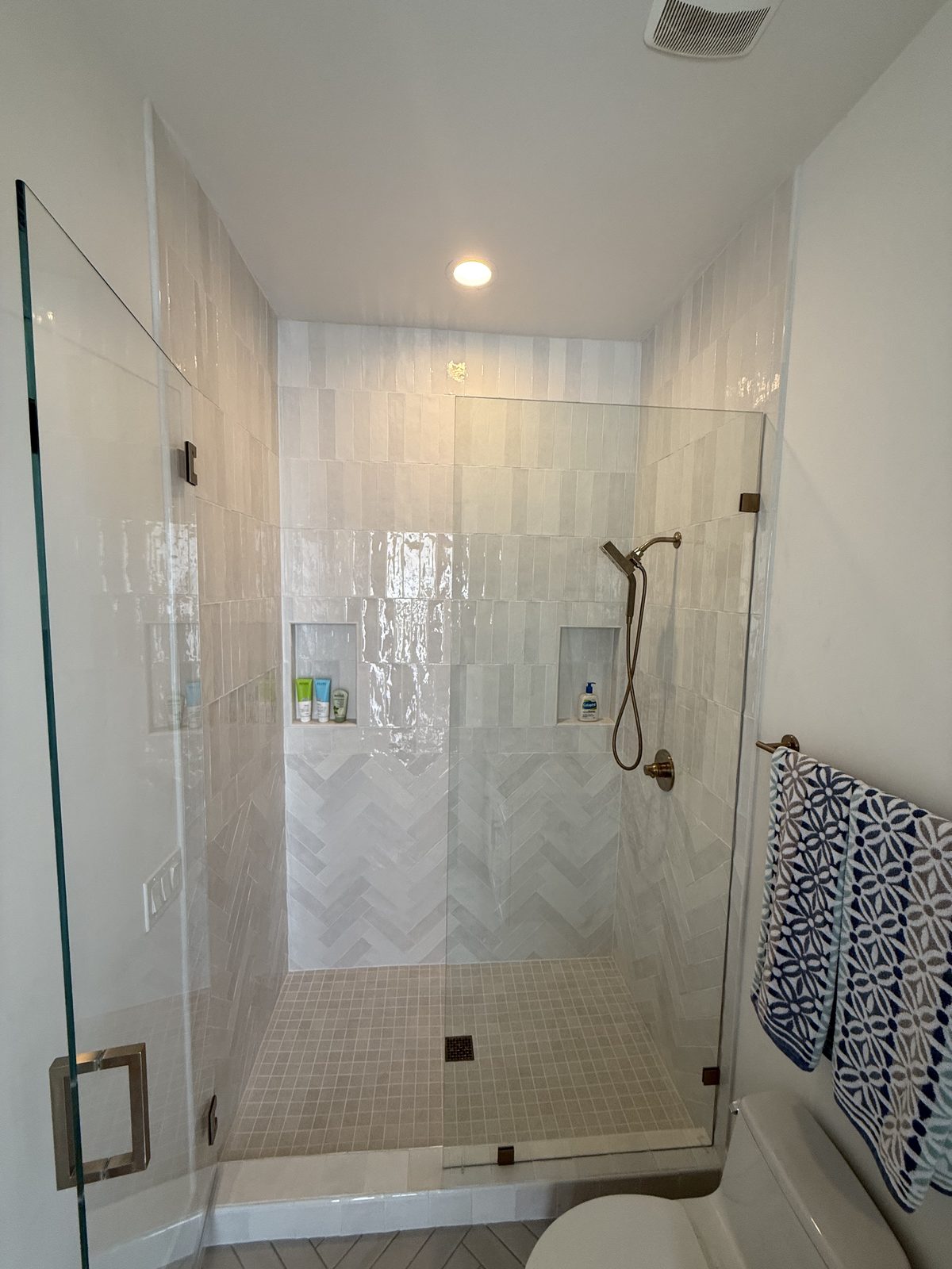 Onyx hex tile shower with bench in a Peoria modern home