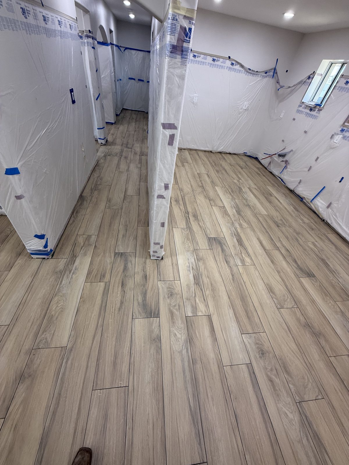 HEPA air scrubber and dust containment setup by Level Up Tile during bathroom remodel in Peoria AZ